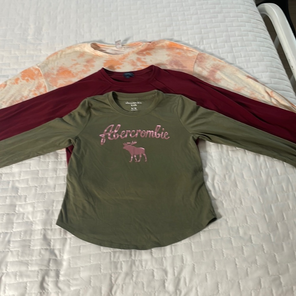 3 long sleeve girls shirts, 1 Old Navy, 1 Abercrombie kids, 1 daytrip